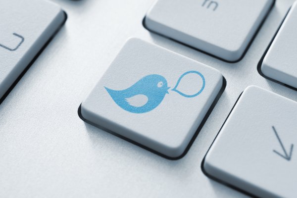 Keyboard with Twitter symbol on key.