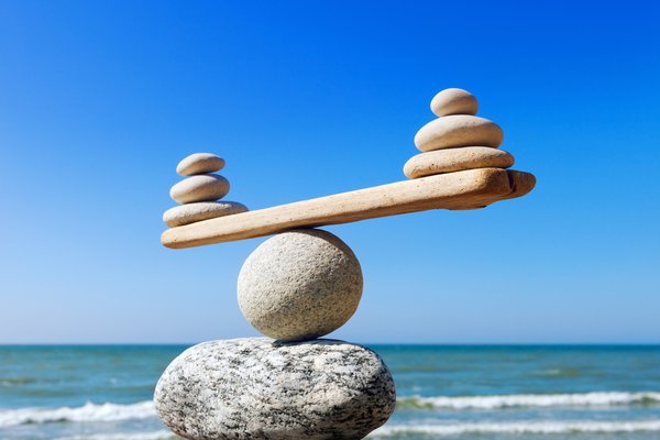 Balancing rocks sitting on the beach.