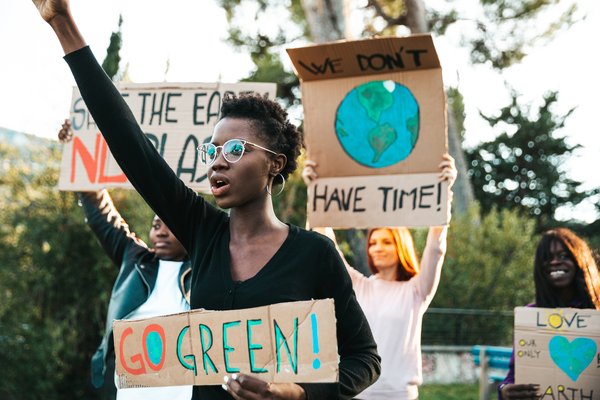 Protesters demonstrating for green energy and environmental causes.
