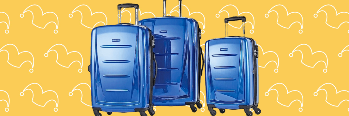 Three blue rolling suitcases against a yellow background