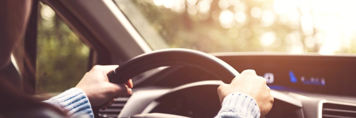 Man driving a car.