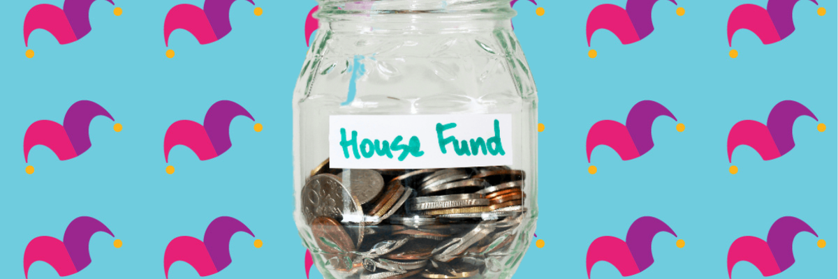 A glass jar that reads House Fund half filled with coins