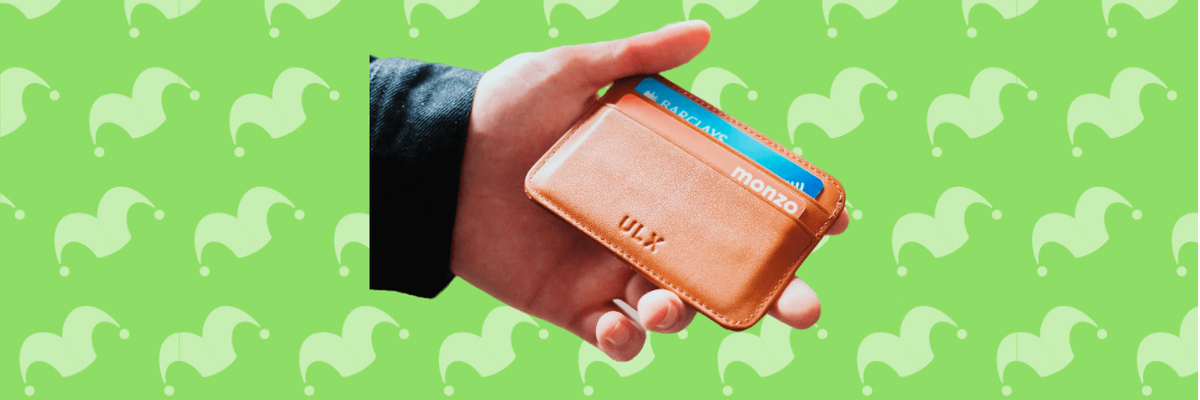 A hand holding a wallet