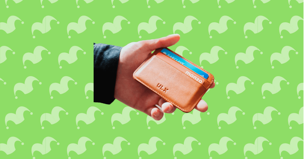 A hand holding a wallet