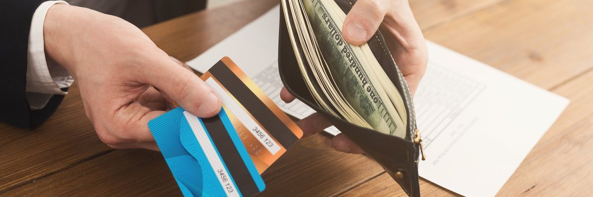2 credit cards and wallet with cash