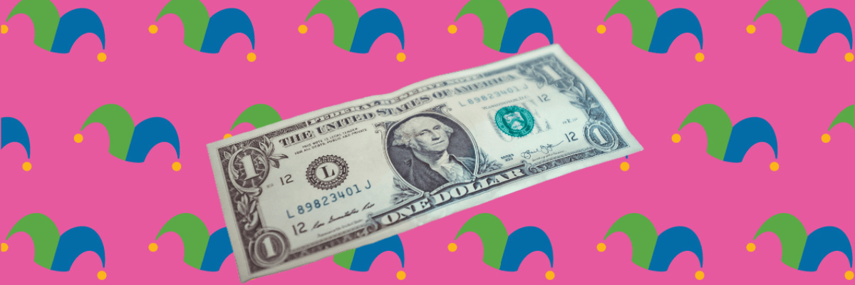 A dollar bill against a pink background