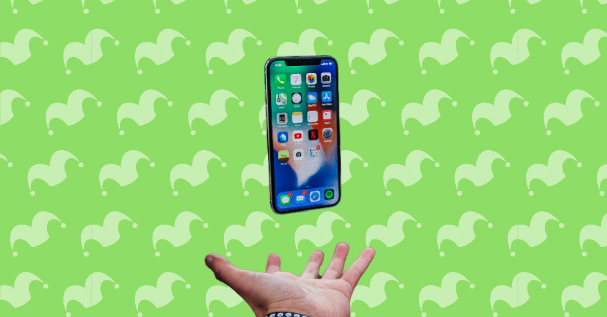 A hand tossing an iphone in the air