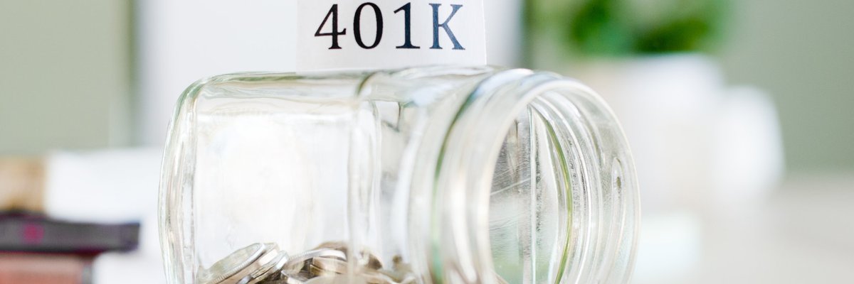 Tipped over jar with money in it labeled 401(K)