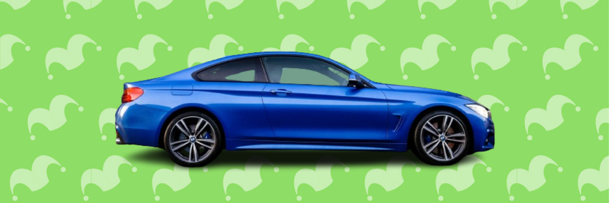 A blue sports car against a green background