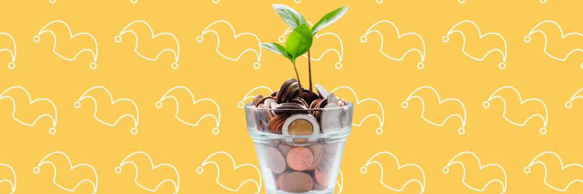 A class pot filled with coins and a sprout growing