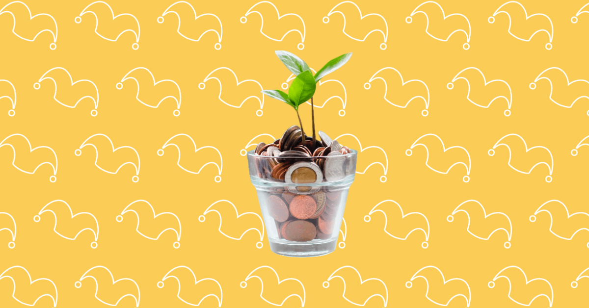A class pot filled with coins and a sprout growing