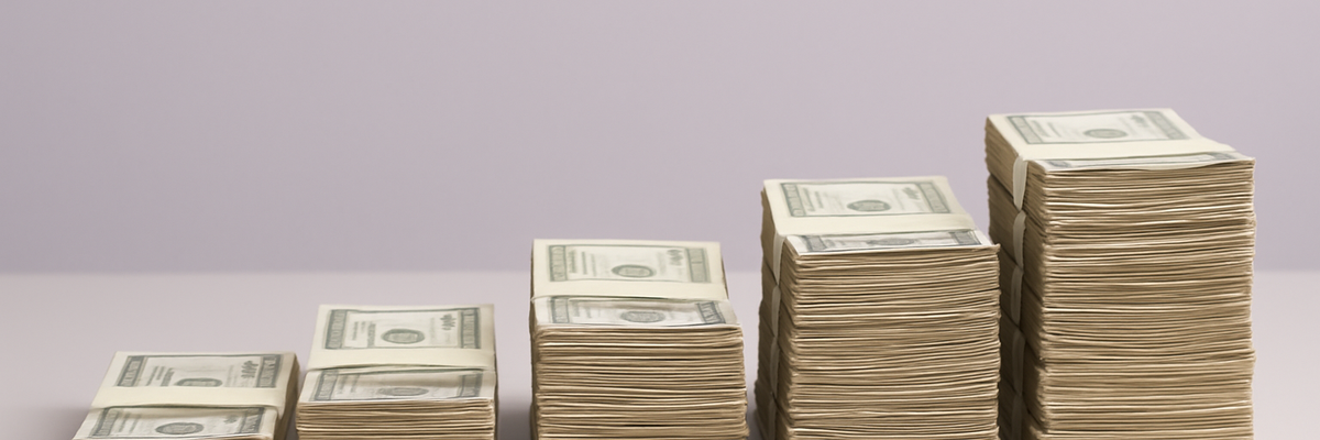Five stacks of bills ordered from small to large on a light purple background.