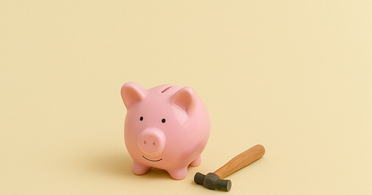 A piggy bank with a small hammer beside it.