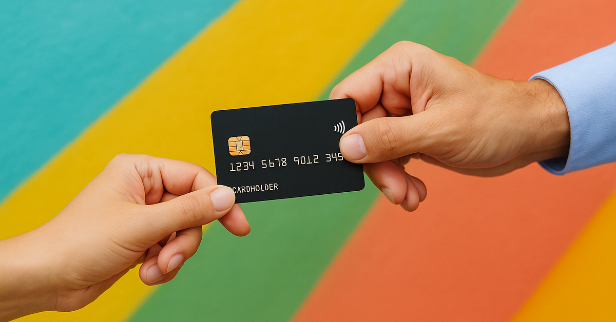 Two hands holding a credit card between them.