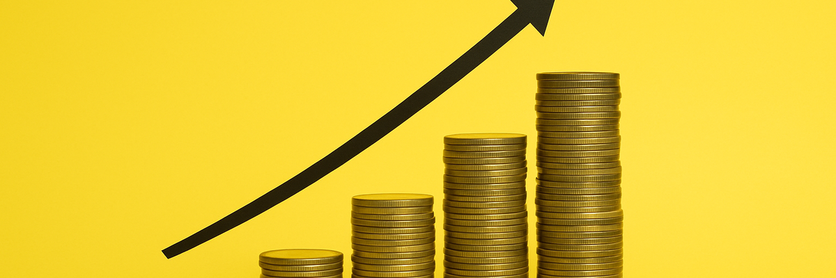 A bar chart made from coins against a yellow background.