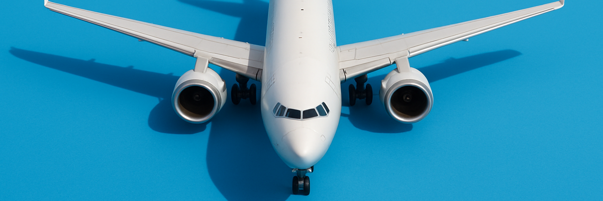 A commercial airplane against a blue background.