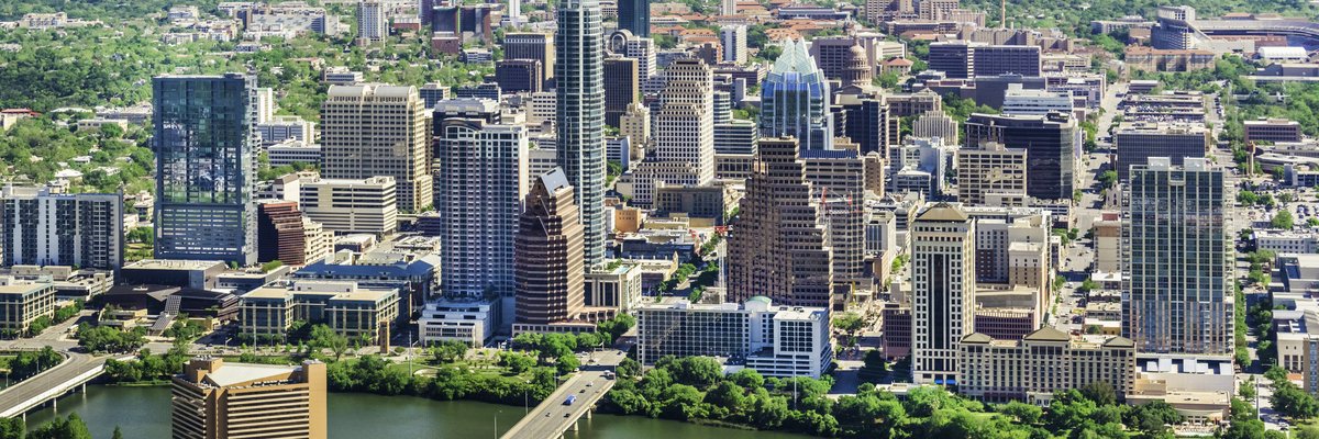 Downtown buildings in Austin, Texas next to a river.