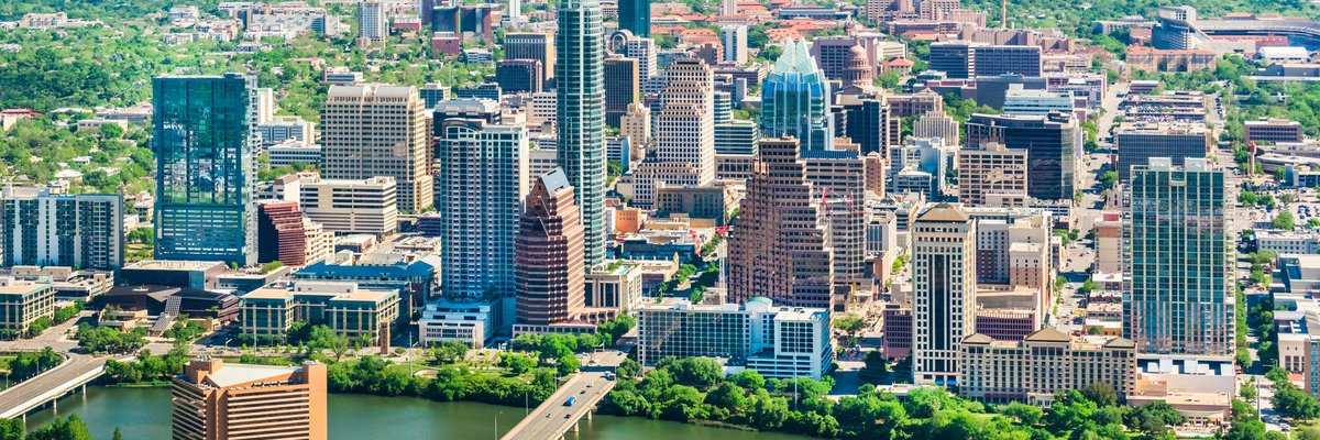 Downtown buildings in Austin, Texas next to a river.