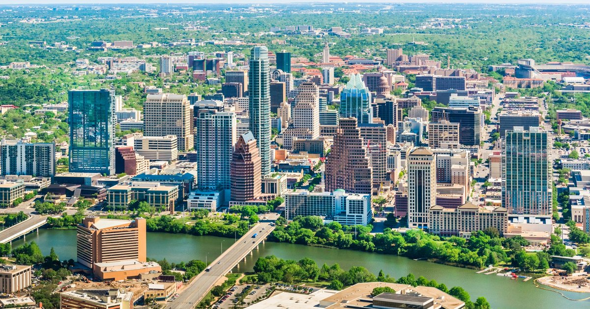 Downtown buildings in Austin, Texas next to a river.