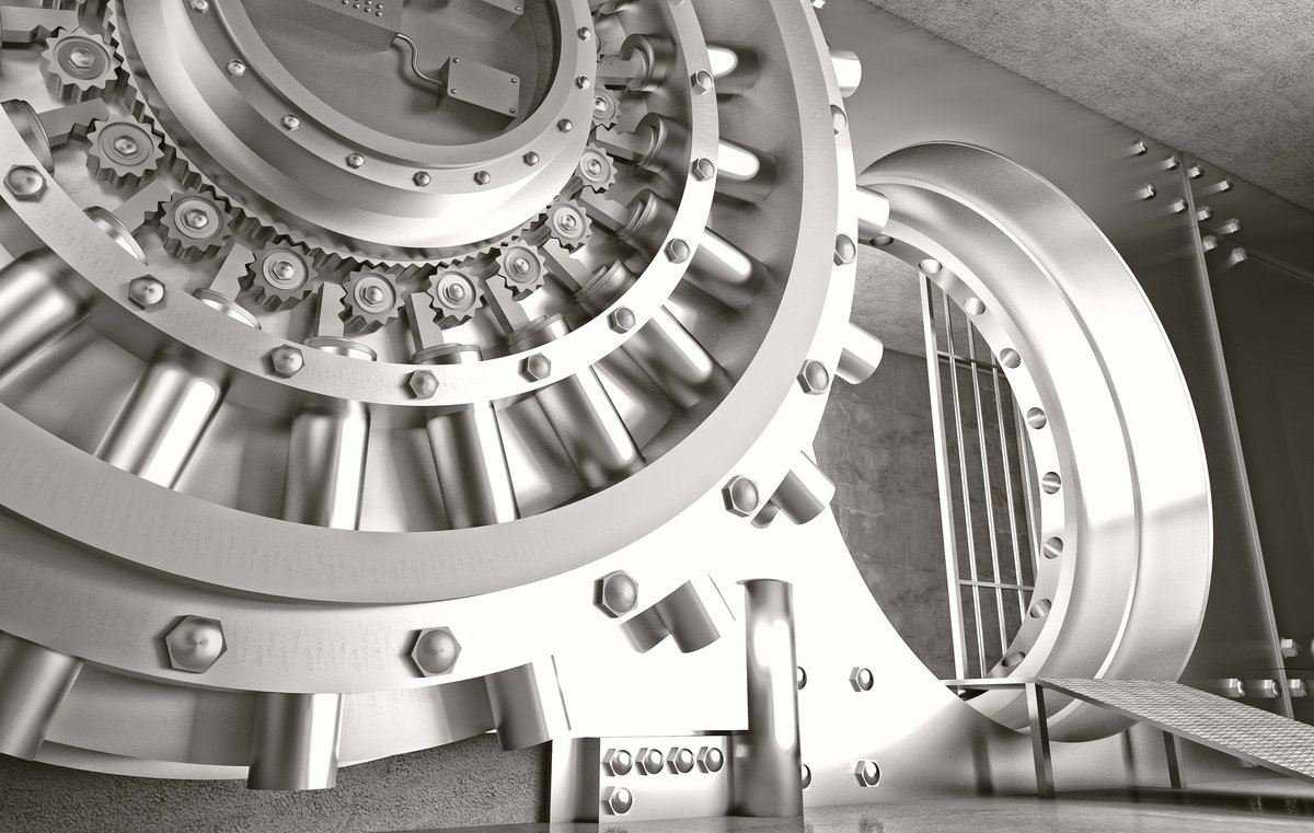 Metal bank vault door, open and showing inside.