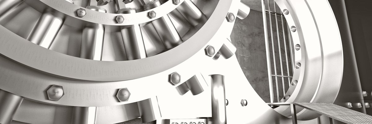 Metal bank vault door, open and showing inside.