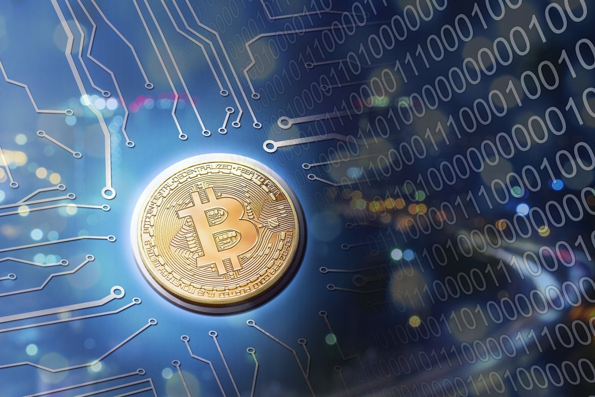 A golden Bitcoin on a blue circuit background.