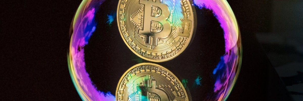A coin with the Bitcoin B inside of a bubble.