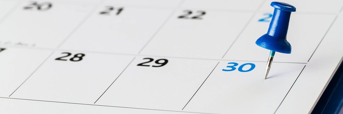 Calendar with a thumbtack pressed into the last day of the month.