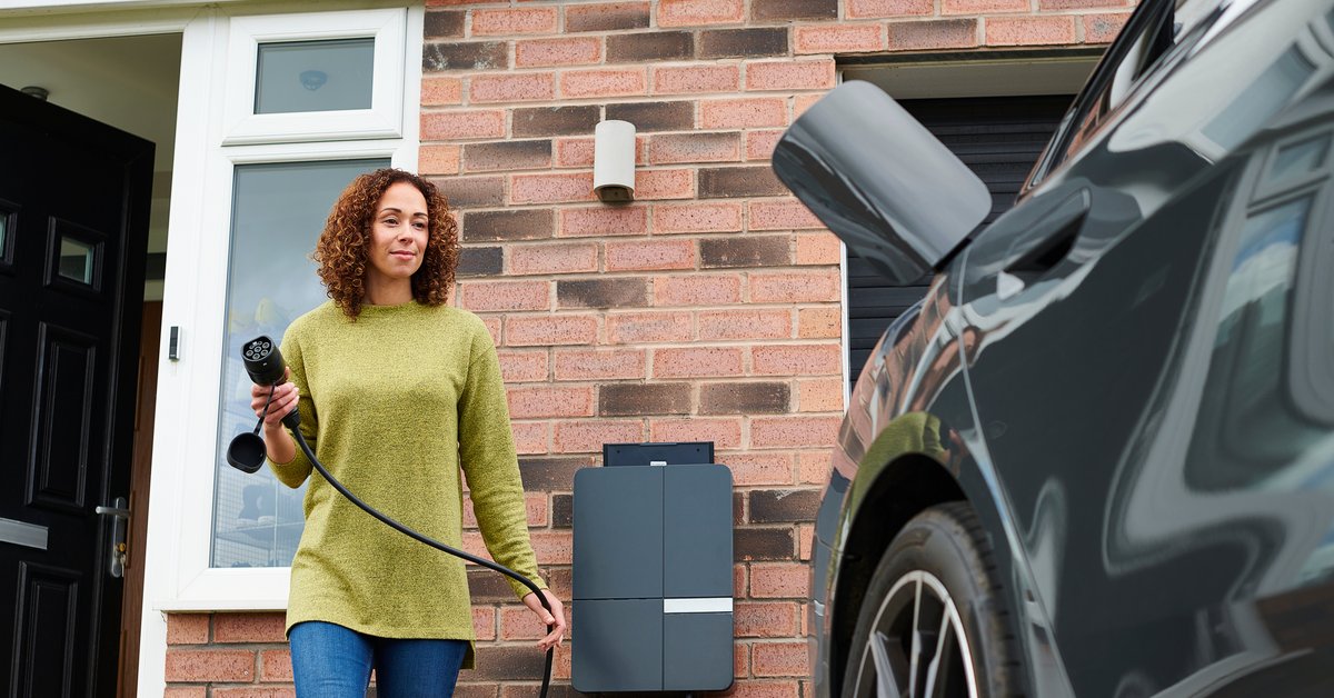 Car owner charging her EV or hybrid vehicle.