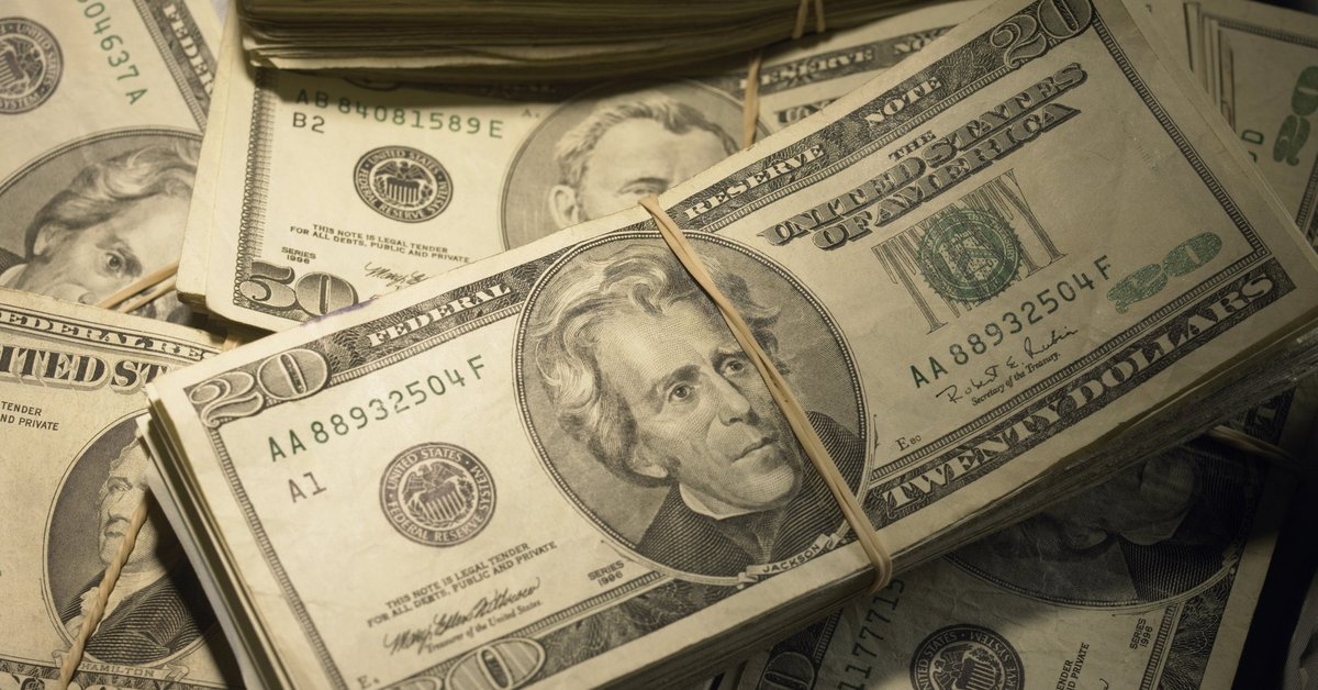 Wads of money piled on top of each other.
