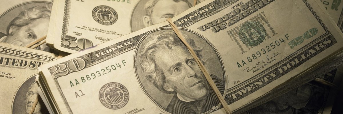 Wads of money piled on top of each other.