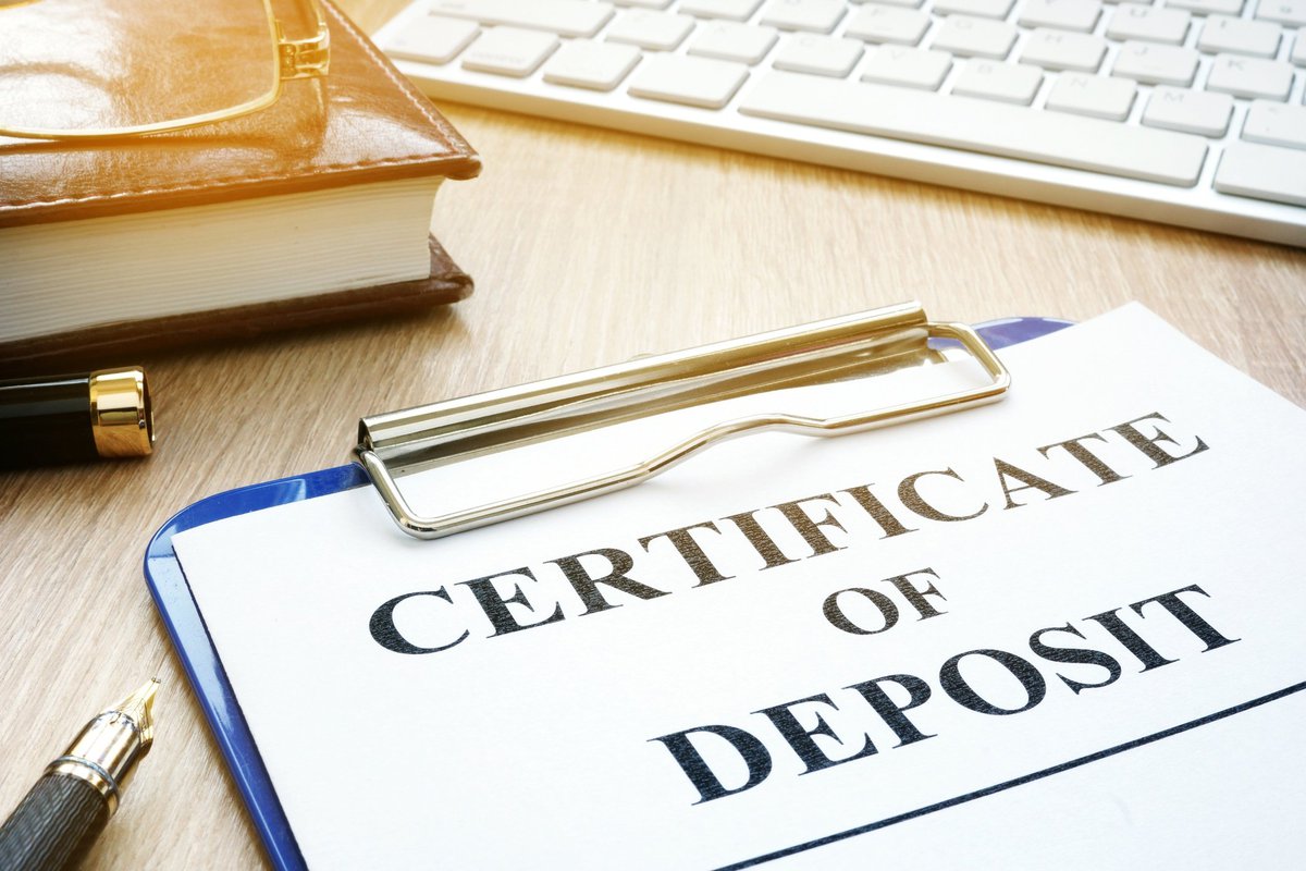Certificate of deposit sign on a clipboard.