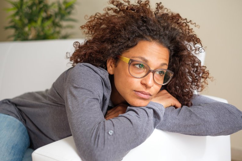 Concerned Young Woman In Glasses