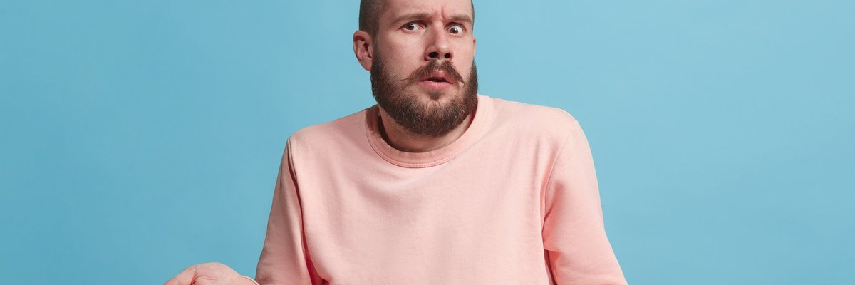 Man shrugging in confusion