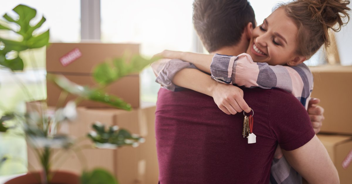 Couple Hugging With Keys.jpg