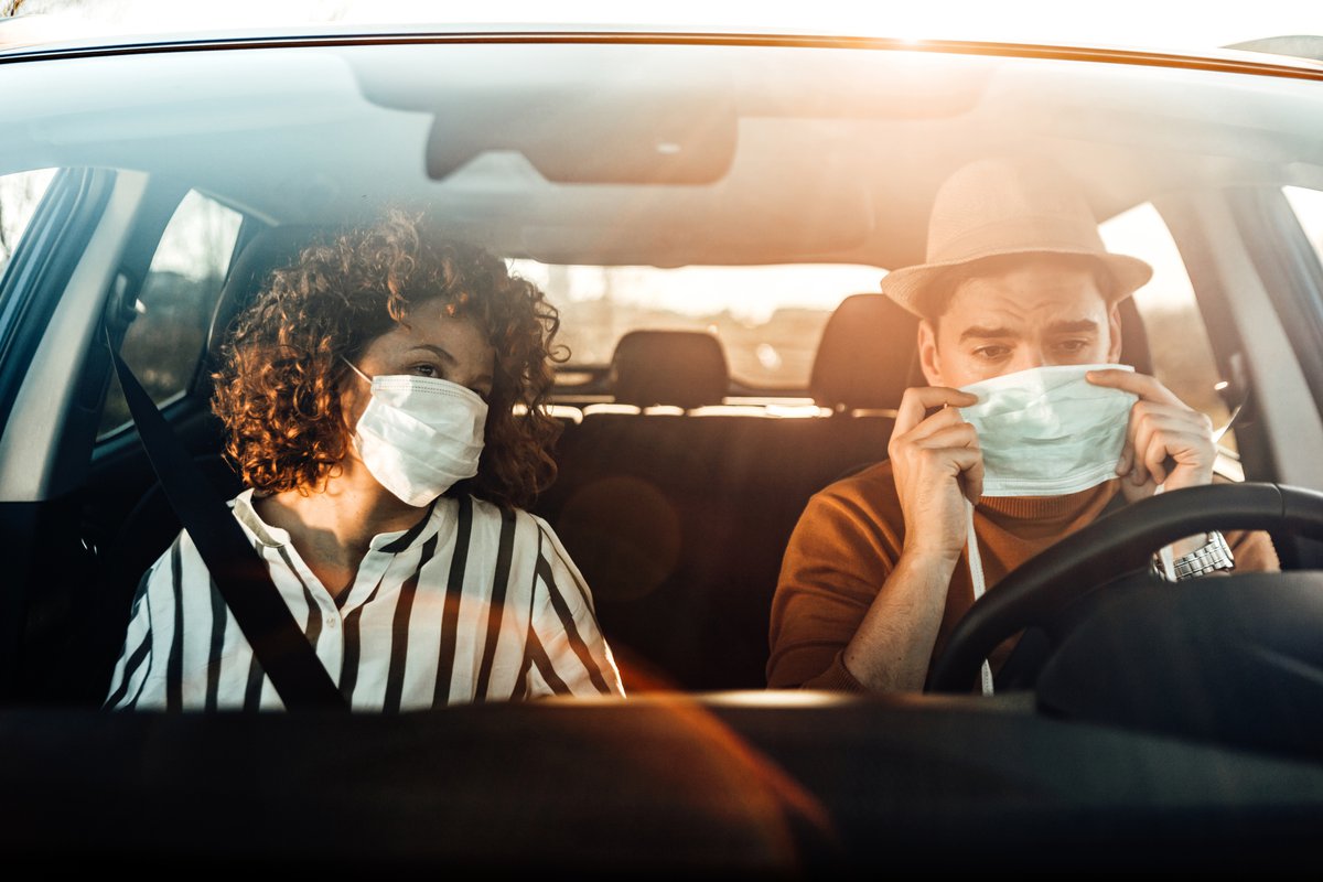 Couple In Car With Masks