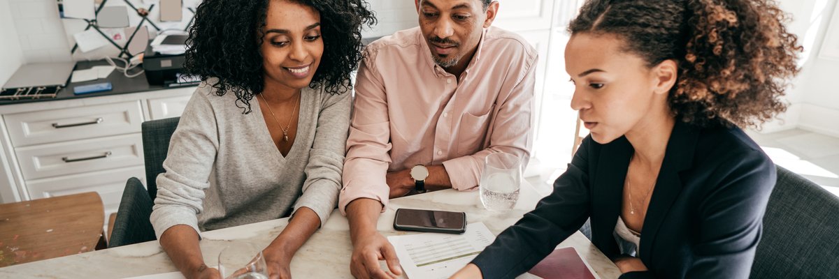 A couple go over their personal finances with a lender.