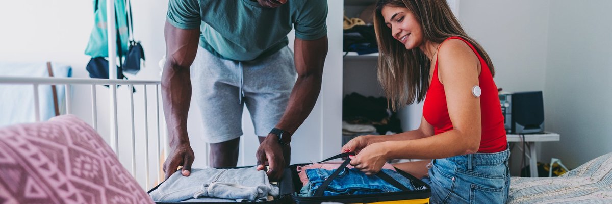 Couple packing a suitcase or vacation.