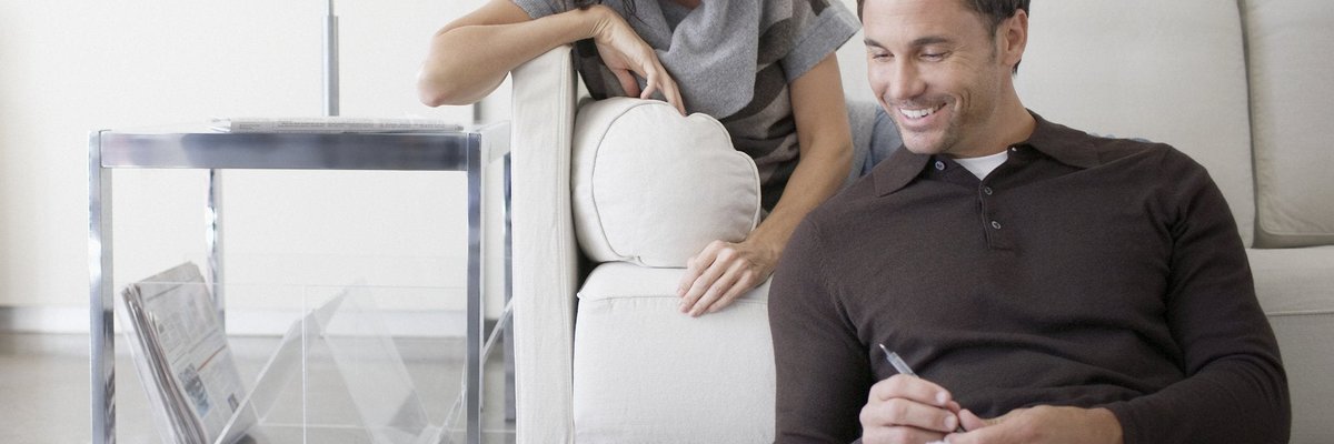 Couple looks at a laptop