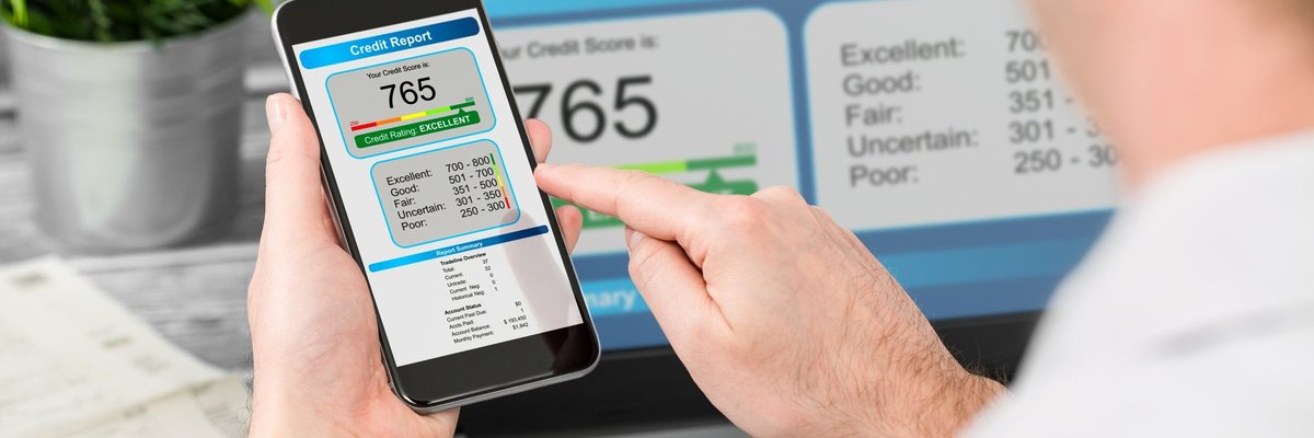 Man Viewing Credit Score On Smartphone