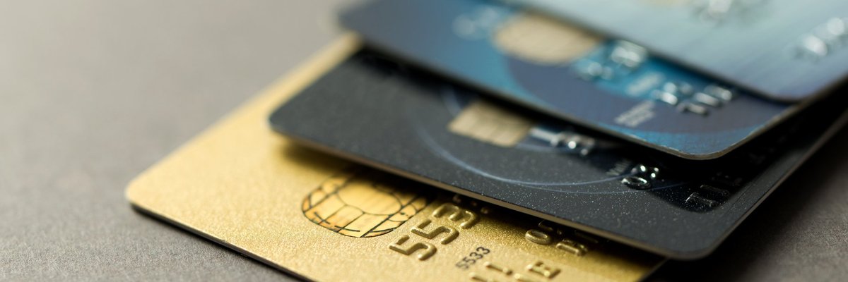 A pile of different-colored credit cards.