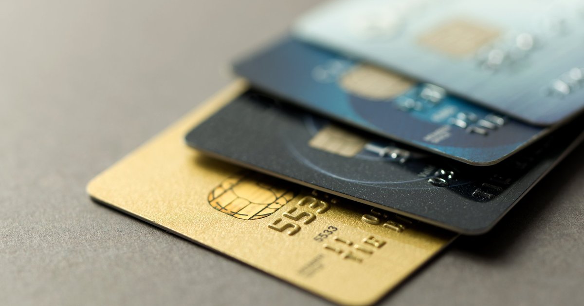 A pile of different-colored credit cards.