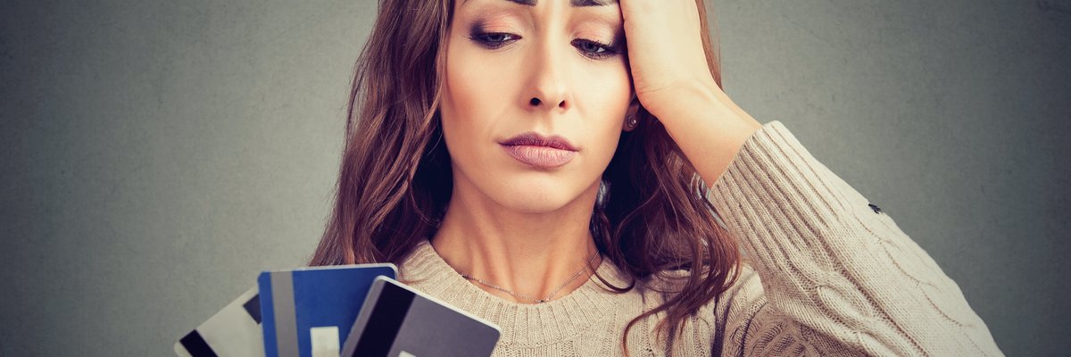 woman distressed by credit cards