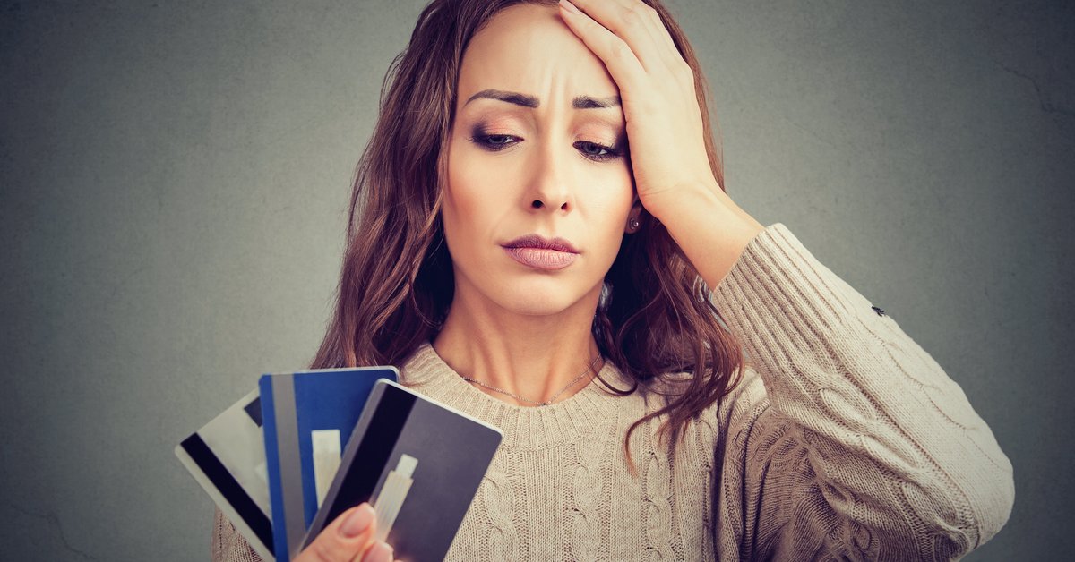 woman distressed by credit cards