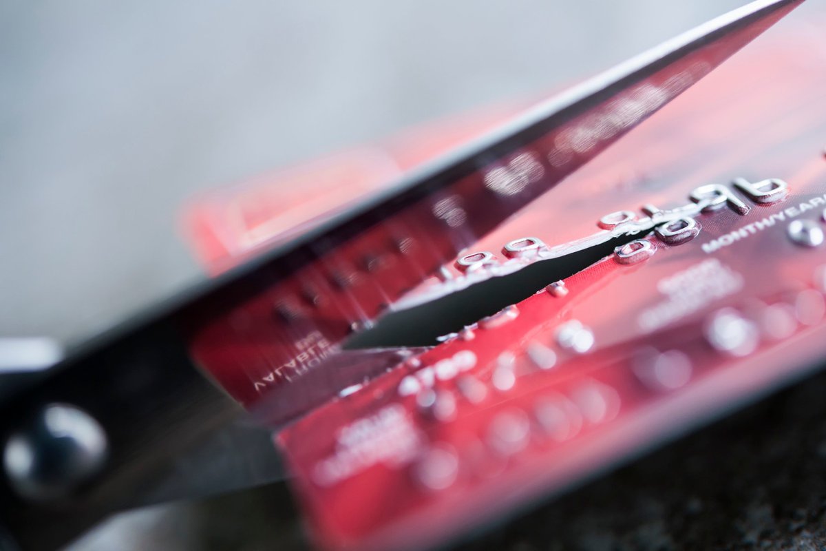 credit card being cut by a pair of scissors