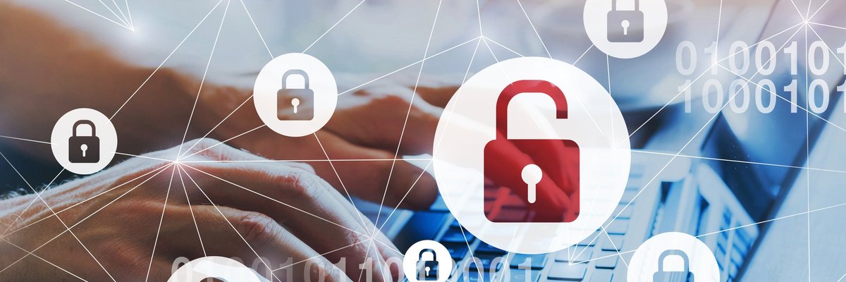 Data breach: web of locked padlocks and one unlocked padlock superimposed over person typing on a keyboard.