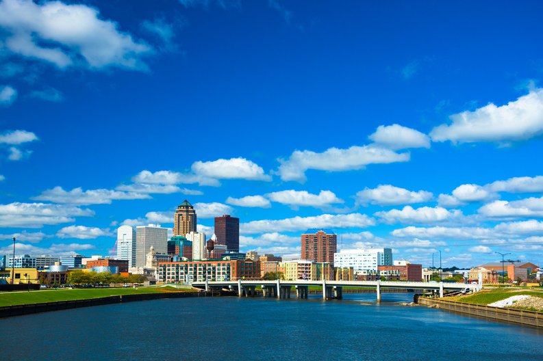 The Des Moines skyline seen from the river on a sunny day.