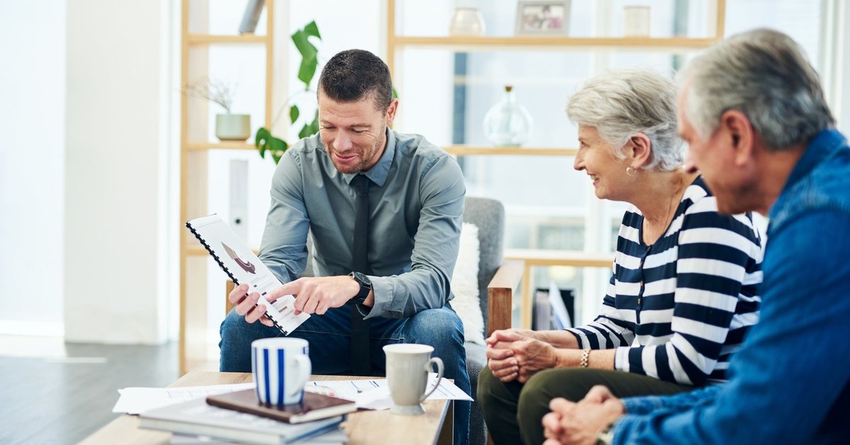 Elderly couple meets with financial advisor
