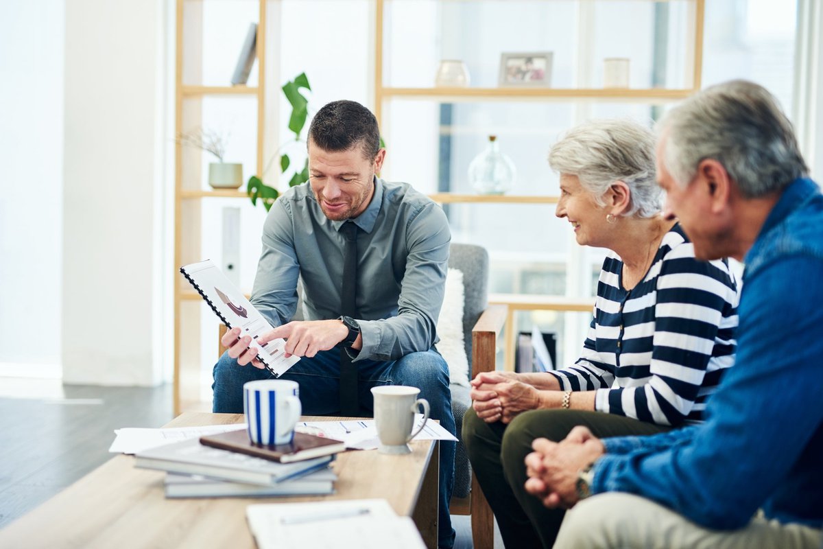 Elderly couple meets with financial advisor