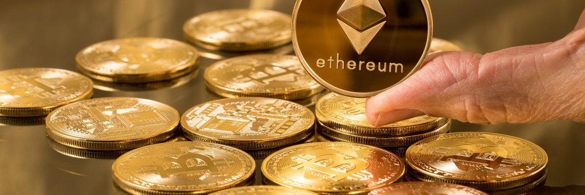 A pile of gold coins and a hand holding one up that says "Ethereum."